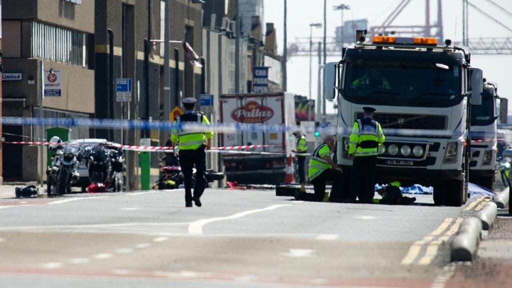 Gardaí investigating a fatal collision involving a motorcyclist and a truck on North Wall Quay in Dublin on Friday. Photograph: Collins.
