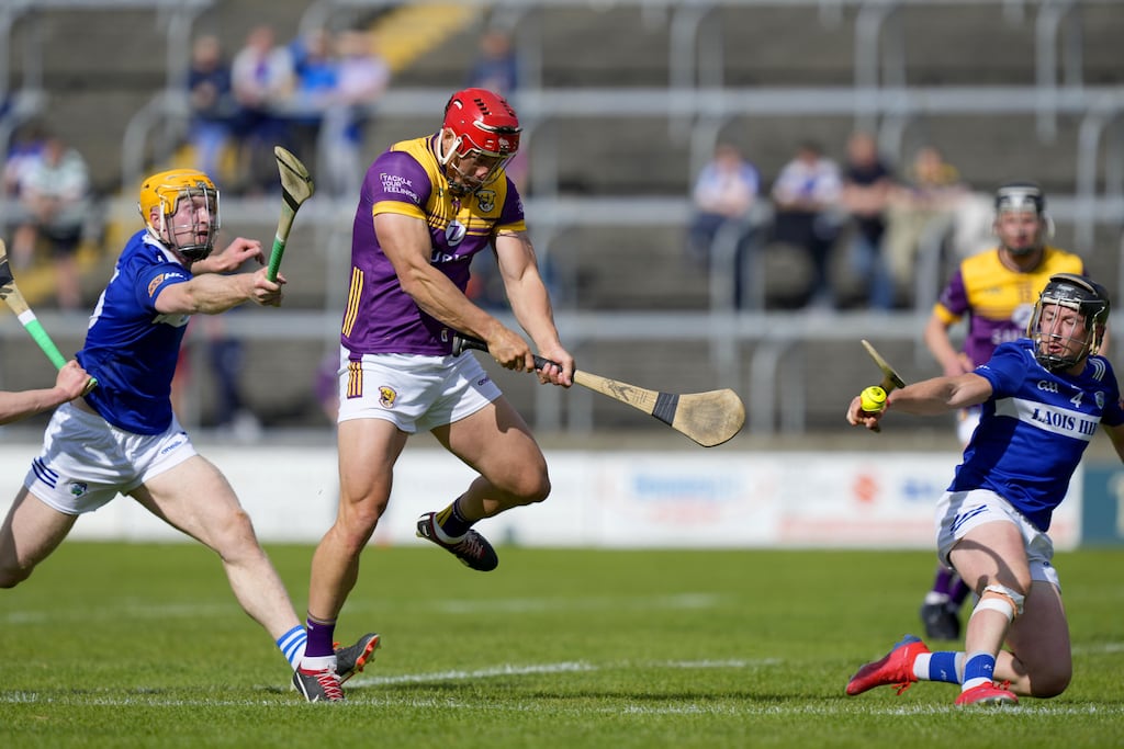 Lee Chin of Wexford sees his shot blocked by Donnchadh Hartnett of Laois during the All-Ireland SHC preliminary quarter-final at Laois Hire O'Moore Park in Portlaoise. Photograph: James Lawlor/Inpho