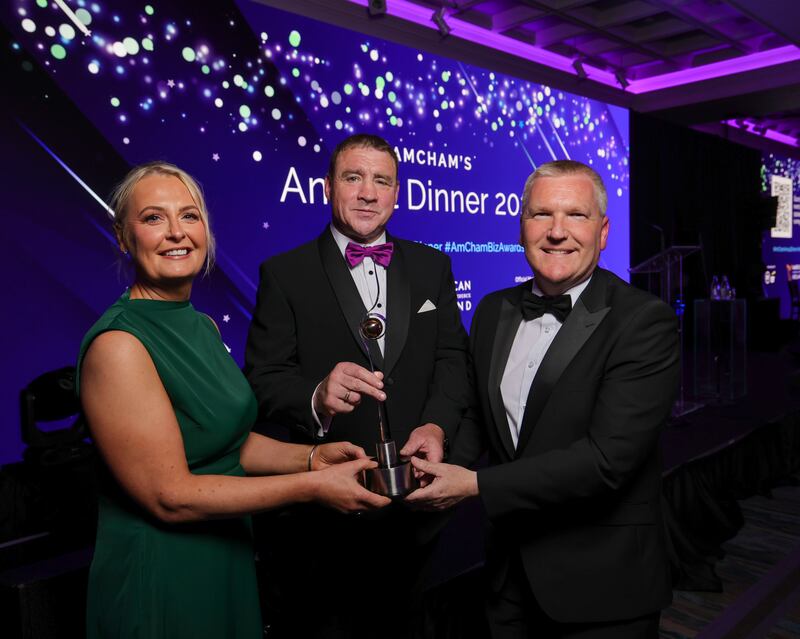 AmCham president, Elaine Murphy and outgoing Minister for Finance, Michael McGrath, presenting the American Chamber 2024 global leadership award to Gerry Kilcommins (centre), former Medtronic Ireland Country Director at the 2024 US-Ireland Business Awards and Annual Dinner. Photograph: Chris Bellew/Fennell Photography