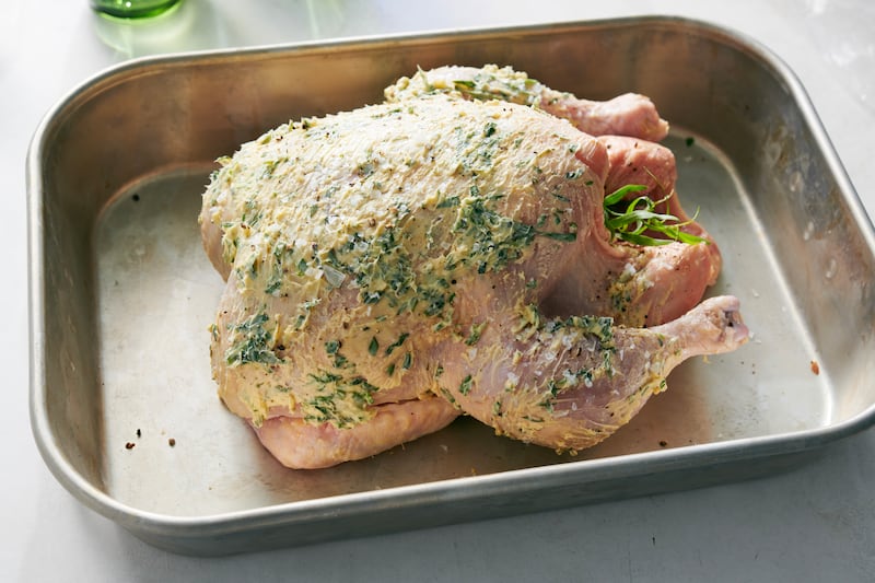 The mixture is then slathered all over the chicken. Photograph: David Malosh/The New York Times