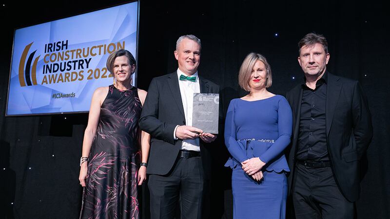 Darragh Coleman, managing director, Williaam Cox, presents the Commercial Project of the Year award to Reddy A+U team.