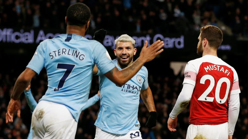 Manchester City’s Sergio Agüero celebrates scoring his hat-trick goal with Raheem Sterling. Photograph: Andrew Yates/Reuters