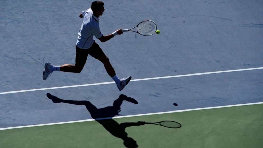 Novak Djokovic chases down a shot during a second round match in the Arthur Ashe Stadium. Barton Silverman/The New York Times
