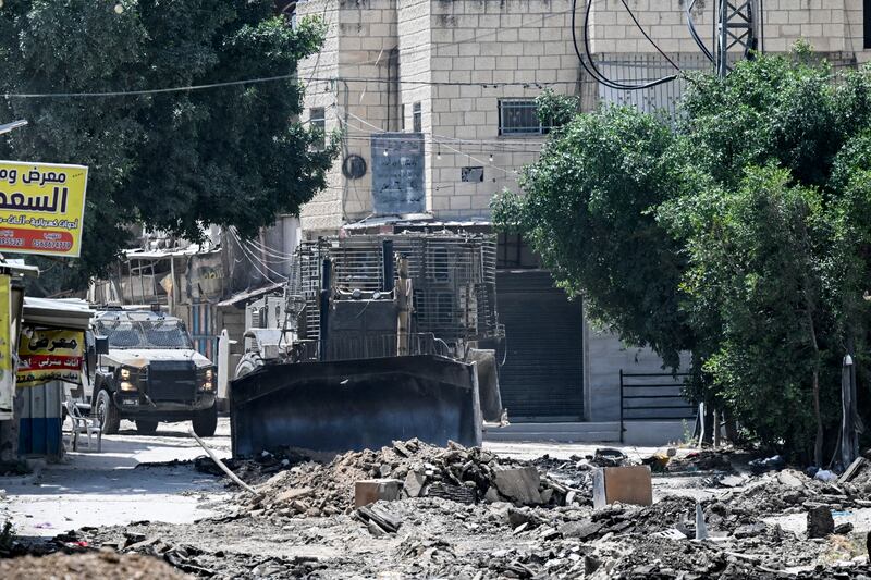 Israeli forces move with armoured vehicles behind bulldozers digging up a main road in Jenin during a raid on the Palestinian city in the occupied West Bank on Tuesday. Photograph: Ronaldo Schemidt/AFP via Getty