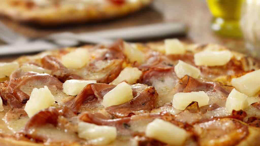 Ham and pineapple pizza with mozzarella.