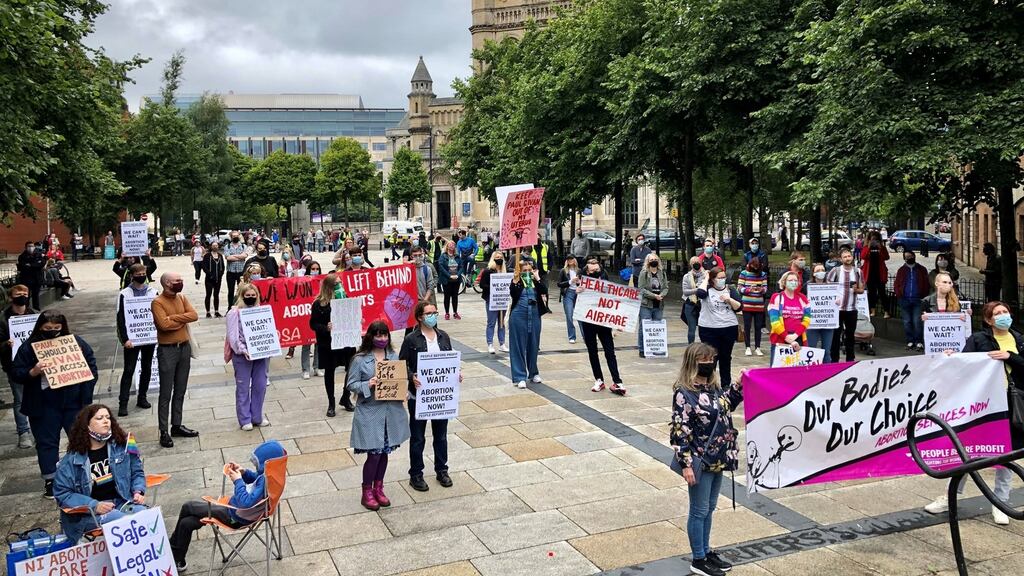 People hold up placards and banners as they take part in a pro-choice rally in Belfast’s Writer’s Square on Saturday. Photograph: David Young/PA Wire
