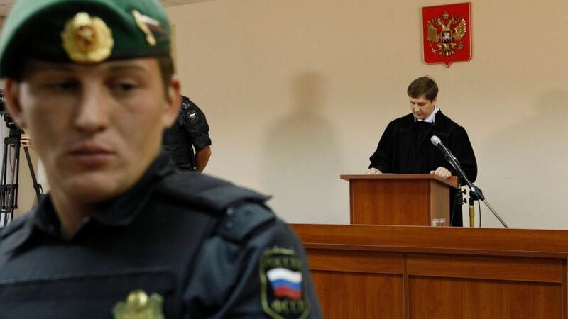 Judge Sergei Blinov reads out the verdict during a hearing of Alexei Navalny’s trial. Photograph: Sergei Karpukhin/Reuters