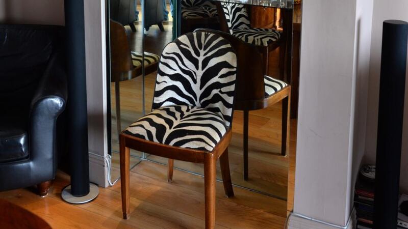 Glass mirrored cabinet in a former fireplace in Billy Peat’s home. Photograph: Dara Mac Dónaill