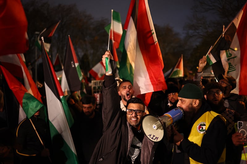 Pro-Palestinian protesters flying a variety of flags including the Palestinian flag and flag of Iraq, shout slogans during a demonstration near Villa Park last night. Photograph: Henry Nicholls/AFP/Getty Images