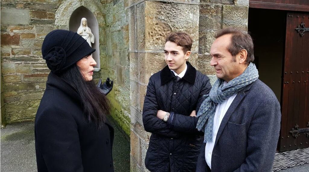 Bertrand Bouniol (right) and his son Baptiste speak to Yvonne Ungerer following an anniversary Mass for Sophie Toscan du Plantier in Goleen, Co Cork. Photograph: Barry Roche