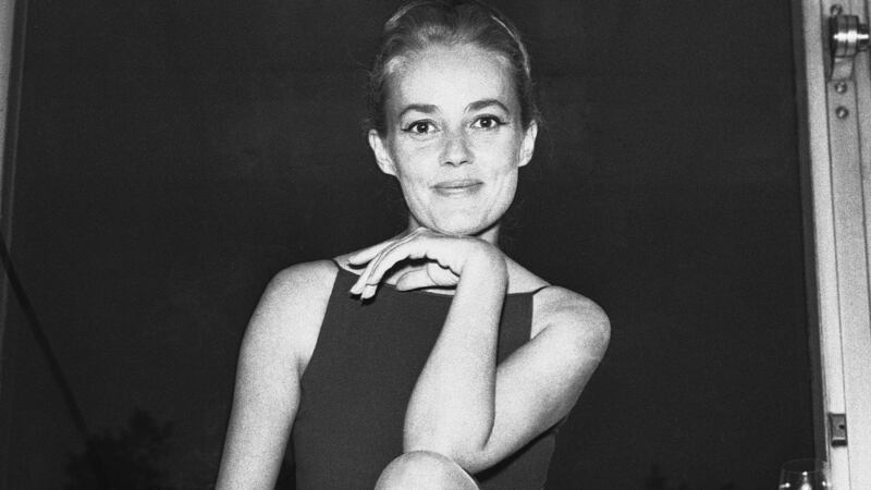 1962: Jeanne Moreau poses for a photo at an airport in London, shortly after her arrival from Paris