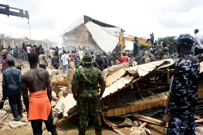 The scene of the school collapse in Nigeria. Photograph: AP