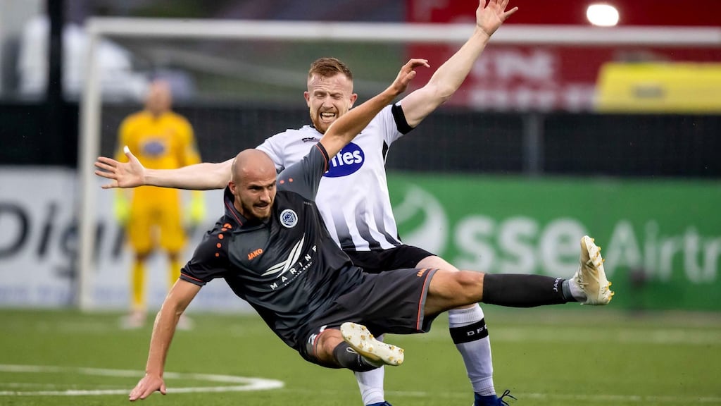 Dundalk’s Sean Hoare tackles Roman Debelko of Riga FC. Photo: Morgan Treacy/Inpho