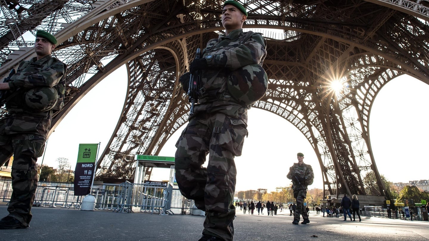 A French soldier stands guard at Eiffel Tower on November 15, 2015 in Paris, France. As France observes three days of national mourning members of the public continue to pay tribute to the victims of Friday’s deadly attacks. Photograph: David Ramos/Getty Images