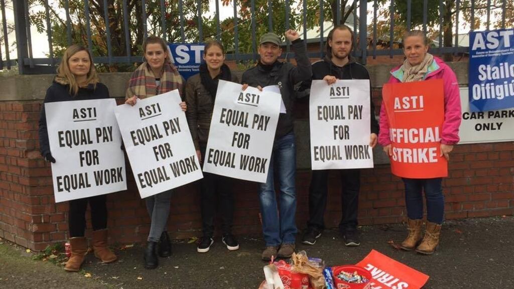 People Before Profit Alliance TD Gino Kenny and Cllr Madeleine Johansson, middle, with teachers at an ASTI picket  in recent days. Photograph: Facebook