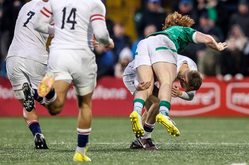 England's Monty Bradbury tackles Henry McErlean of Ireland, later receiving a red card. Photograph: Ben Brady/Inpho
