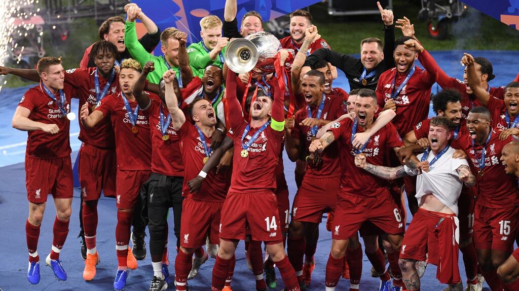 Jordan Henderson of Liverpool lifts the Champions League Trophy. Photo: David Ramos/Getty Images