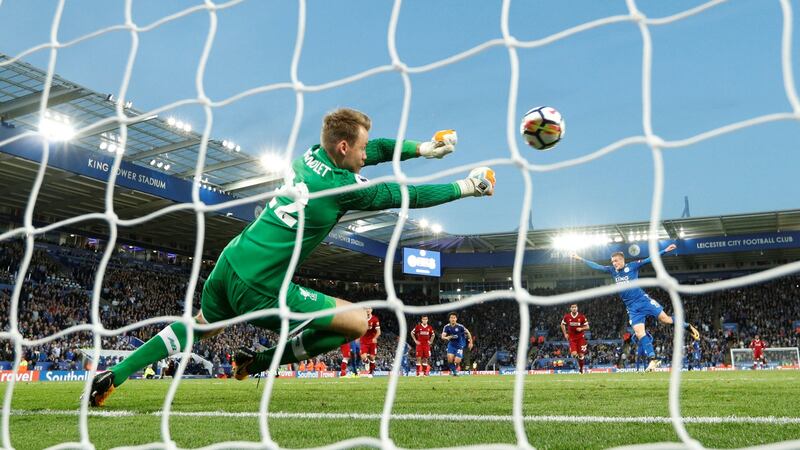 Liverpool’s Simon Mignolet saves a penalty from Jamie Vardy. Photograph:John Sibley/Reuters