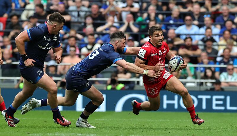 Toulouse's Antoine Dupont goes past Leinster's Robbie Henshaw during the Investec Champions Cup final. Photograph: David Rogers/Getty Images