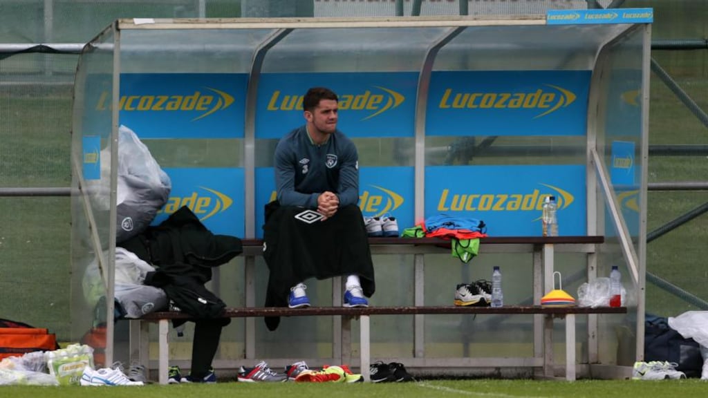 Republic of Ireland’s Robbie Brady sits on the bench injured during a training session at Gannon Park, Malahide. Photograph: Niall Carson/PA Wire.
