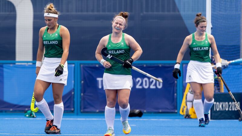 Elena Tice, Sarrah Torrans and Roisin Upton dejected after defeat to the Netherlands. Photo: Morgan Treacy/Inpho