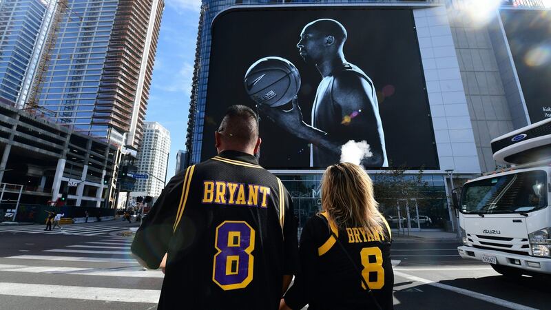 Fans dressed in their Kobe Bryant jerseys  in Los Angeles, California, the day after the helicopter crash which claimed the life of the former Los Angeles Lakers star and his 13 year old daughter. Photograph: Frederic J. Brown/AFP via Getty