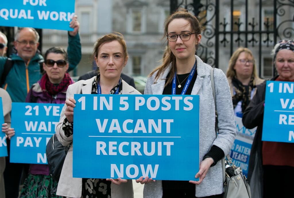Medical Laboratory Scientists Association members Julie McFadden (left) and Lorraine McCarra from St James’s Hospital demonstrate outside Leinster House. Photograph: Gareth Chaney/Collins