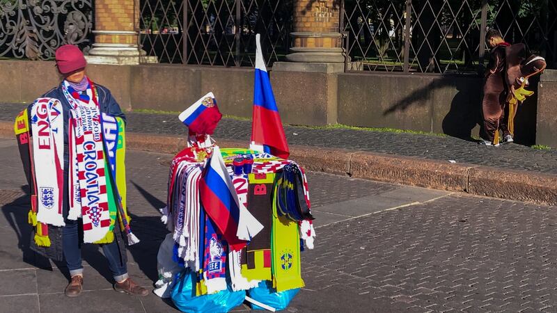A street vendor outside the Church of the Saviour on Spilled Blood in Saint Petersburg. Photograph: Sergio Perez/Reuters