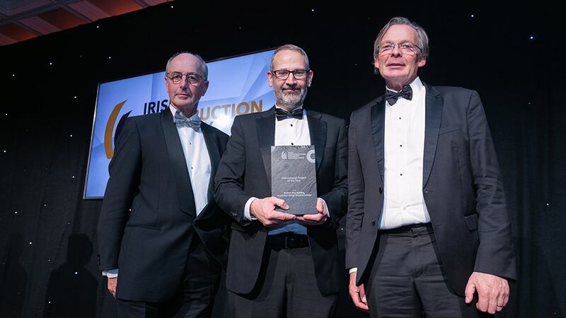 Noel McKernan, general manager, Halt Natural Fire Retardant, presents the International Project of the Year award to Peter Dudley and Eoin O’Morain, Scott Tallon Walker Architects and Edward Williams Architects.