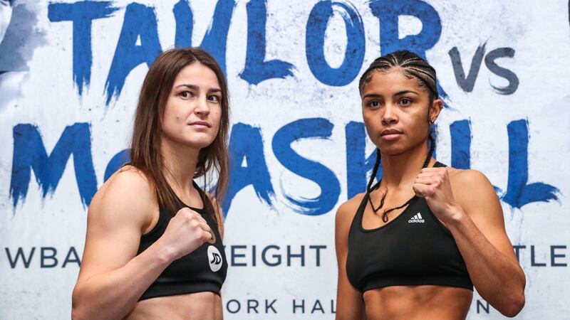Katie Taylor and Jessica McCaskill during the weigh-in at the Courthouse Hotel, Shoreditch. Photo: James Crombie/Inpho