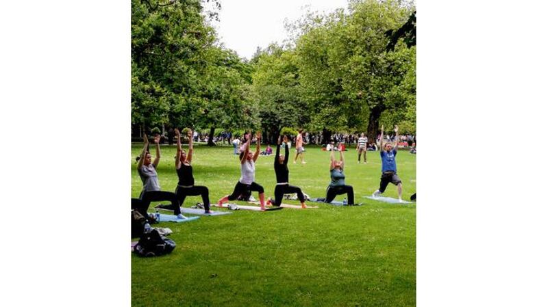 A yoga class in St Stephen's Green, Dublin. photographs: david sleator, alan betson