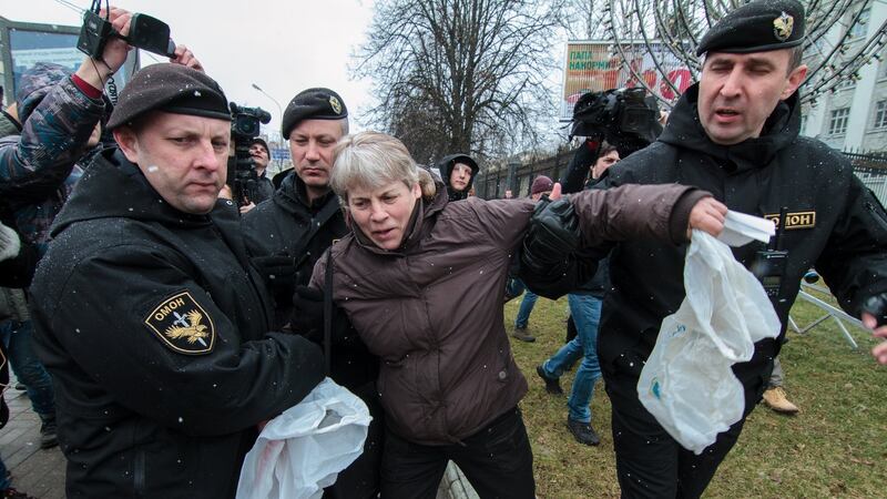 Police officers detain a protester in Minsk, Belarus. Photograph: Stringer/EPA