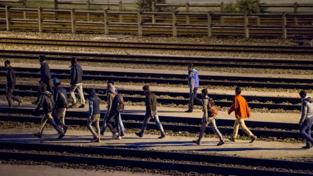 Migrants walk along railway tracks at the Eurotunnel terminal on July 28th. Photograph: AFP