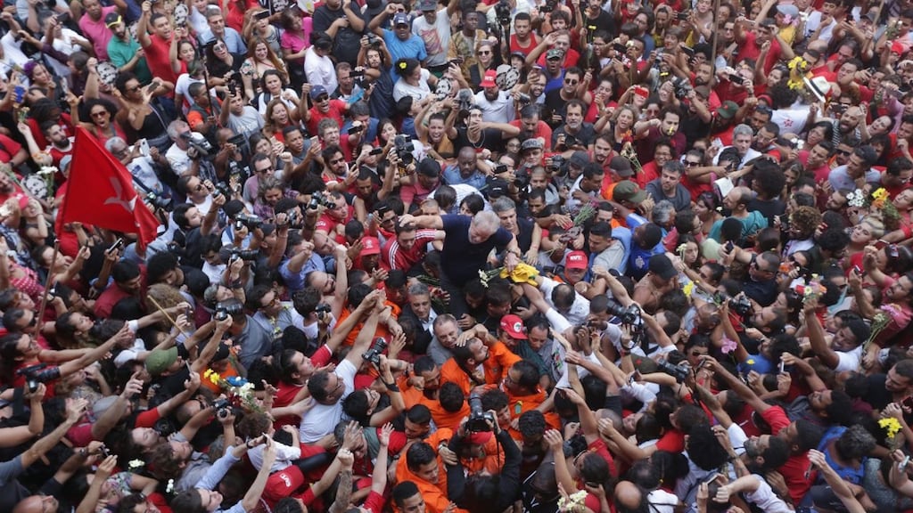 Brazilian ex-president Luiz Inacio Lula da Silva being lifted by supporters after attending a Catholic Mass in memory of his late wife, Marisa Leticia, in Sao Paulo on Saturday. Photograph: Paulo Pinto/AFP/Getty Images
