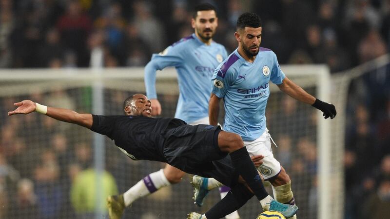 Djibril Sidibe tackles Riyad Mahrez. Photo: Oli Scarff/AFP via Getty Images