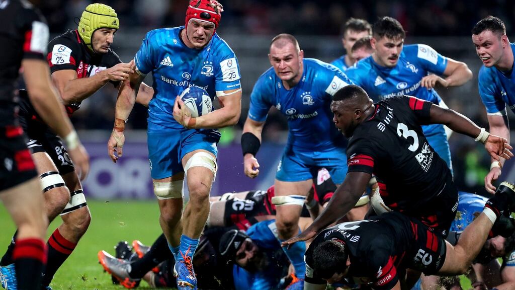 Leinster’s Josh van der Flier attempts to break away from Virgile Bruni of Lyon during the Heineken Champions Cup match at Stadium de Gerland. Photograph: Billy Stickland/Inpho