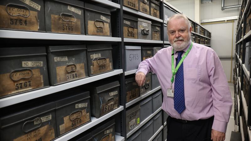 Conor Gallagher of the Land Commission with some of the boxes of files. Photograph: Bryan O’Brien