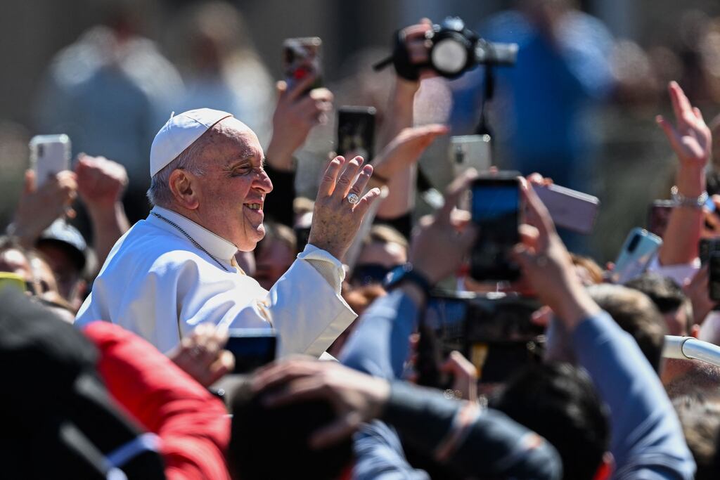 Pope Francis waves from the popemobile car as he makes a tour of St Peter's Square following Easter Sunday Mass in the Vatican. Photograph: Andreas Solaro/AFP/Getty