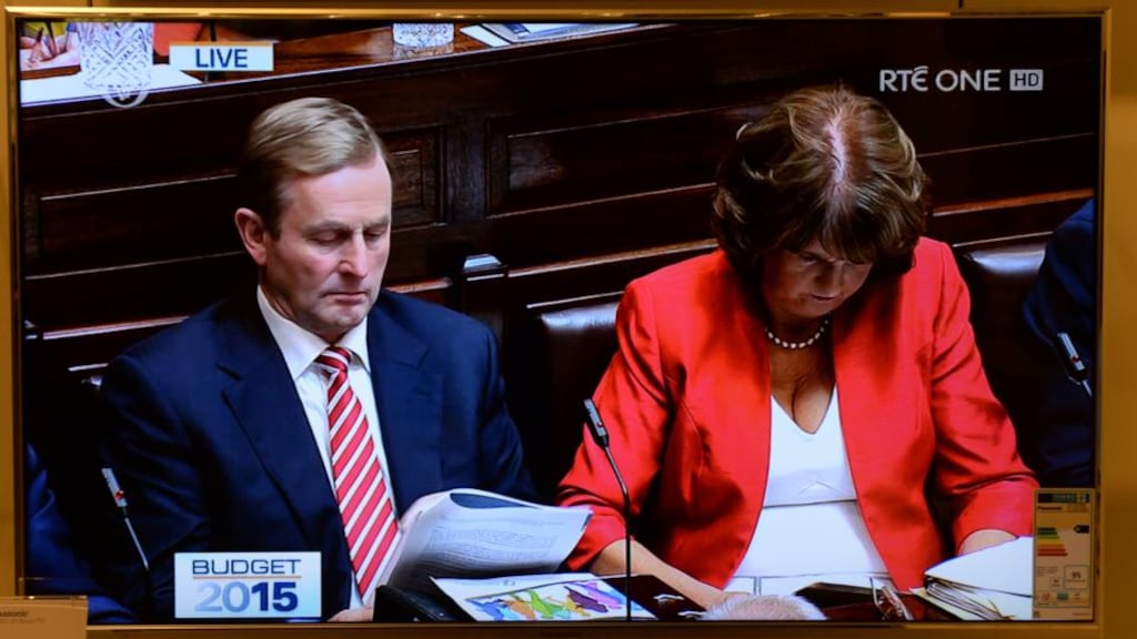 Taoiseach Enda Kenny and Tánaiste Joan Burton during the announcement of Budget 2015: Three opinion polls to be published tomorrow show Fine Gael and Labour struggling for support. Photograph: Dara Mac Dónaill/The Irish Times.
