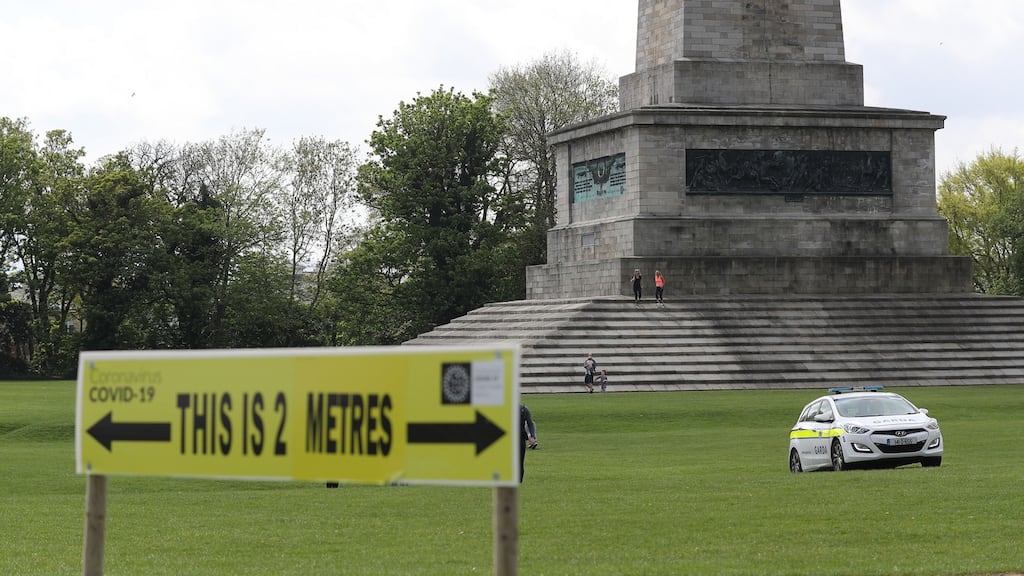A social distancing sign in the Phoenix Park, Dublin, part of restrictions on social and economic life that have been put in place to protect public health. Photograph: Nick Bradshaw