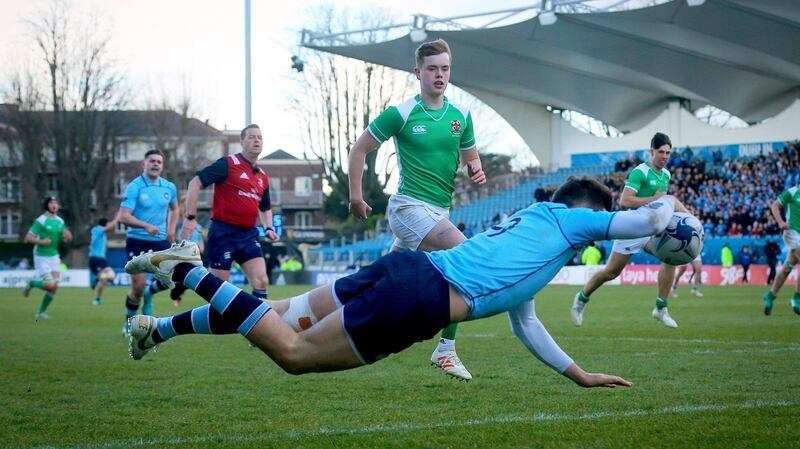 St Michael’s Rob Gilsenan scores a try. Photo: Oisin Keniry/Inpho