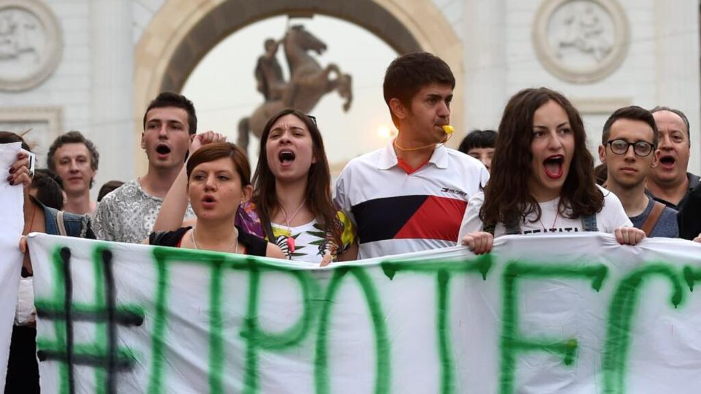 Protesters carry a banner reading ‘#I’m protesting’ as they shout slogans and demand the resignation of the government during an anti-government protest in Skopje, the Former Yugoslav Republic of Macedonia. Photograph: Georgi Licovski/EPA