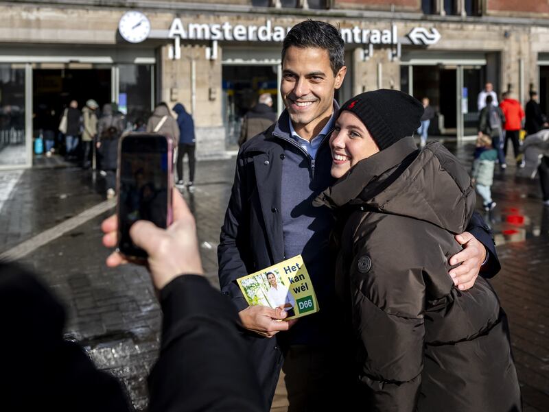 D66 party leader Rob Jetten (centre) campaigns at Amsterdam Central Station on Sunday. Photograph: Remko de Waal/ANP/AFP via Getty