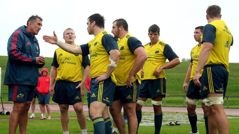 Munster head coach Rob Penney speaks with Damien Varley and John Ryan during a scrum training session. Photograph: Dan Sheridan