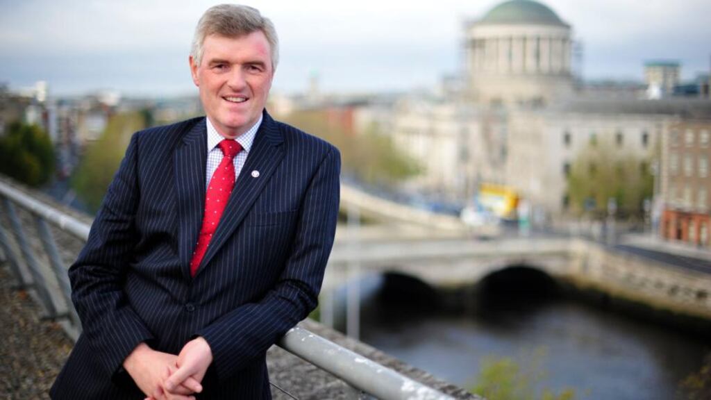 John Tierney faces questions from the Oireachtas environment committee on the setup costs of Irish Water