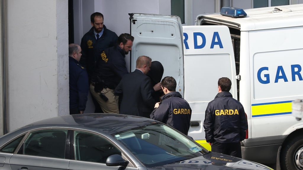 Eamonn Cumberton (29), from Mountjoy Street, Dublin, leaves the Bridewell Garda station before arriving at the District Court where he was charged with the murder of Michael Barr. Photograph: Gareth Chaney Collins