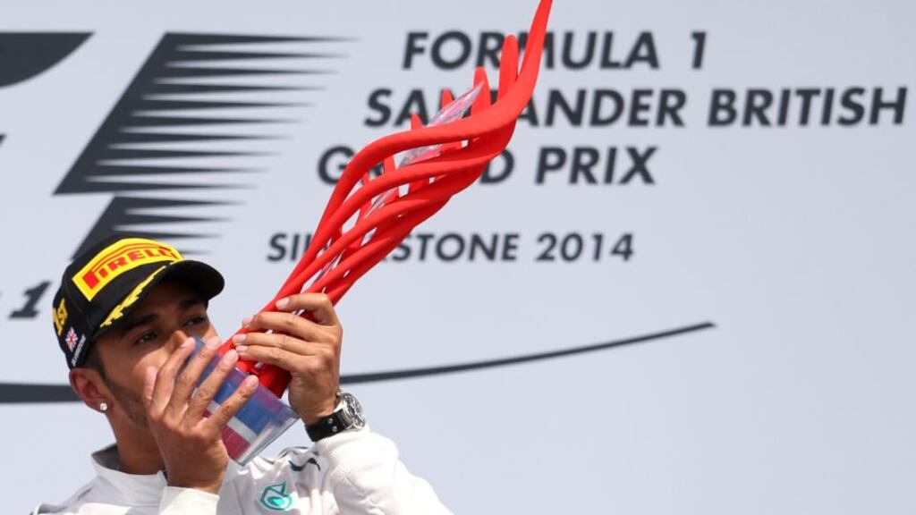 Mercedes driver Lewis Hamilton celebrates after winning the British Grand Prix at Silverstone. Photograph: Francois Lenoir/Reuters