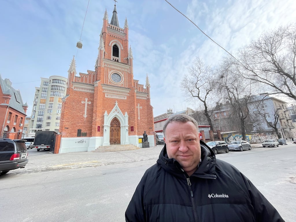 Fr Hryhoriy Semenkov outside Kharkiv's Cathedral of the Assumption of the Blessed Virgin Mary, where local families sheltered at the start of Russia's full invasion of Ukraine a year ago. Photograph: Daniel McLaughlin