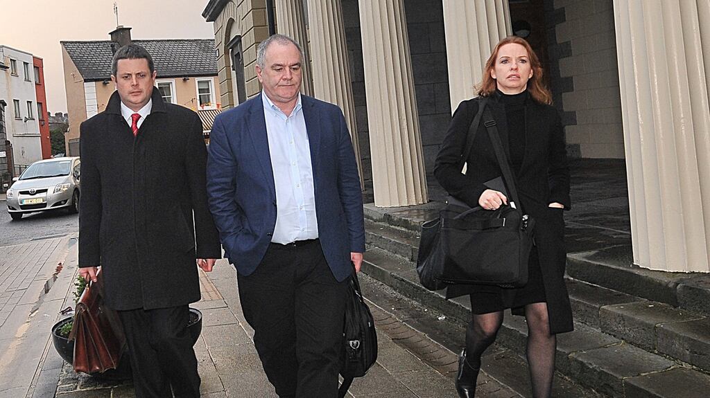 Paul Maguire pictured centre and Janet Traynor from RTE's Investigation Unit attending the Aras Attracta assault trial at the District Court in Castlebar.Pic Conor McKeown