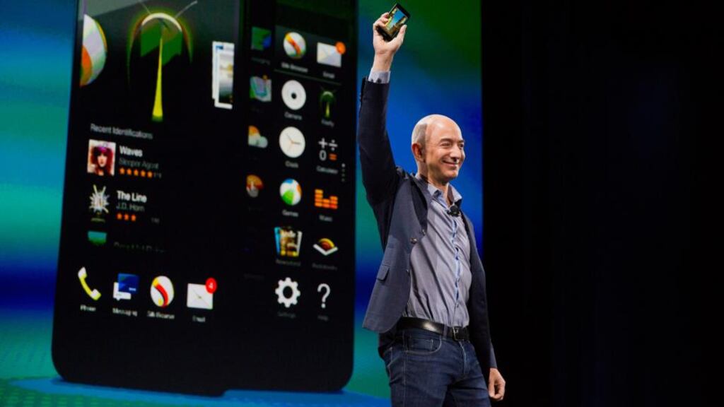 Jeff Bezos, chief executive officer of Amazon, unveils the Fire Phone at Fremont Studios in Seattle, Washington. Photographer: Mike Kane/Bloomberg
